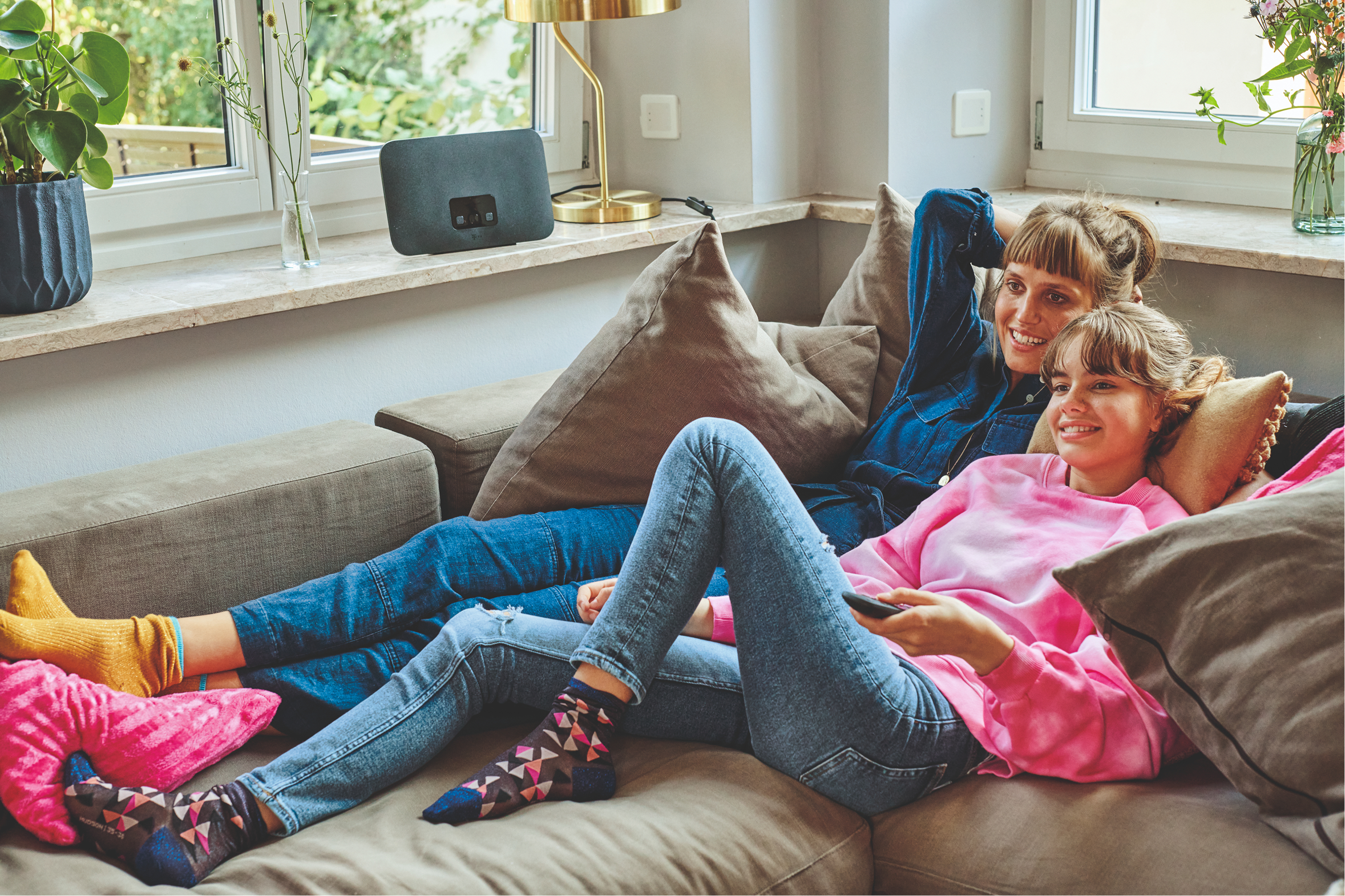 Menschen zu Hause, vernetzt und versorgt über die Telekom
